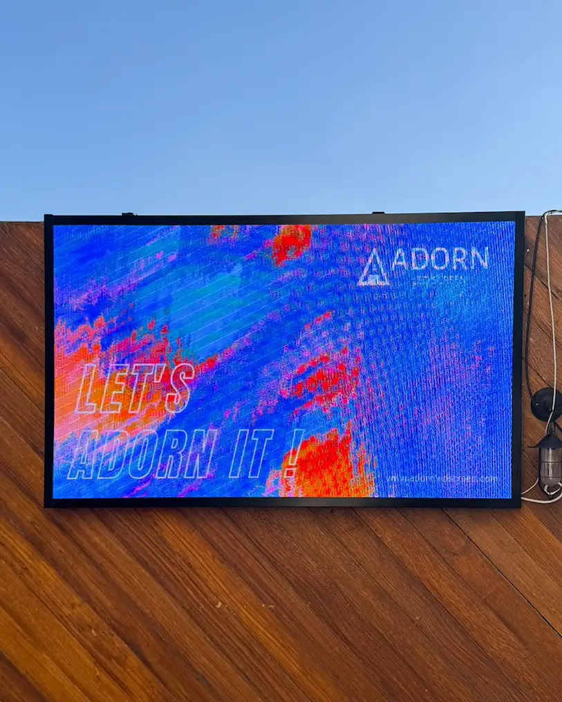 Outdoor LED screen displaying digital content at a hotel