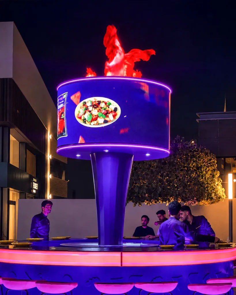 Outdoor LED screen displaying content at a live event
